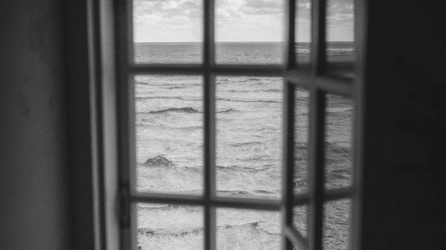 view of the ocean through a window