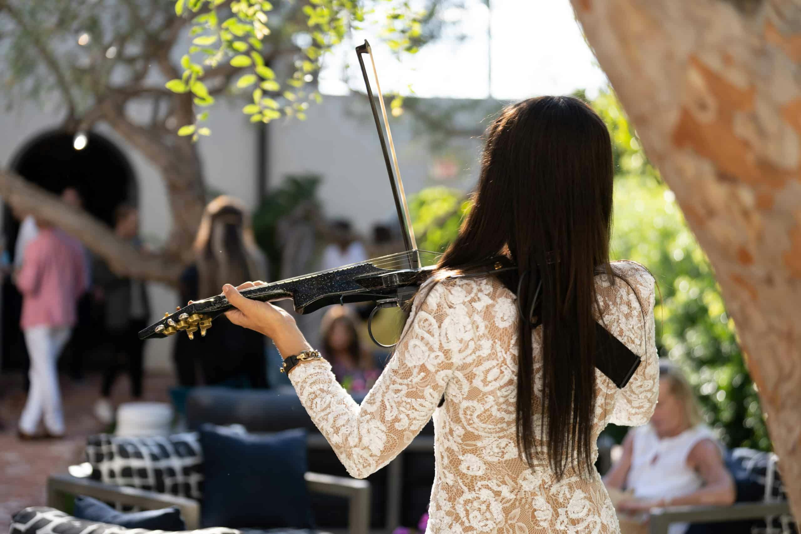 person playing violin at orli hotel la jolla