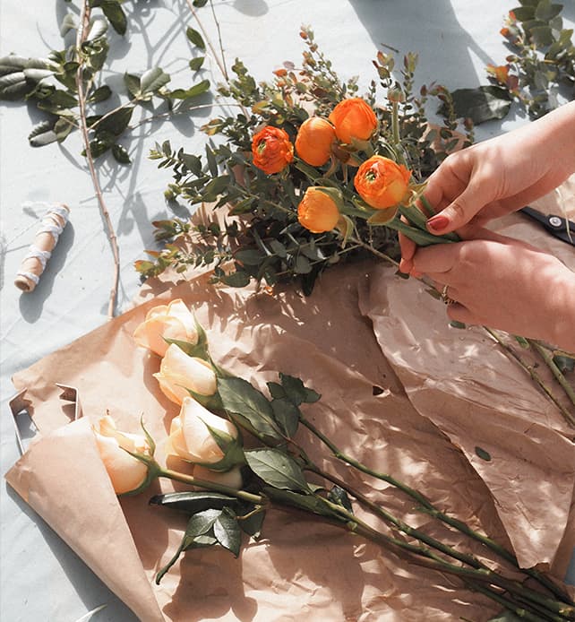 Two bouquets of flowers being prepared for an Orli La Jolla upgrade