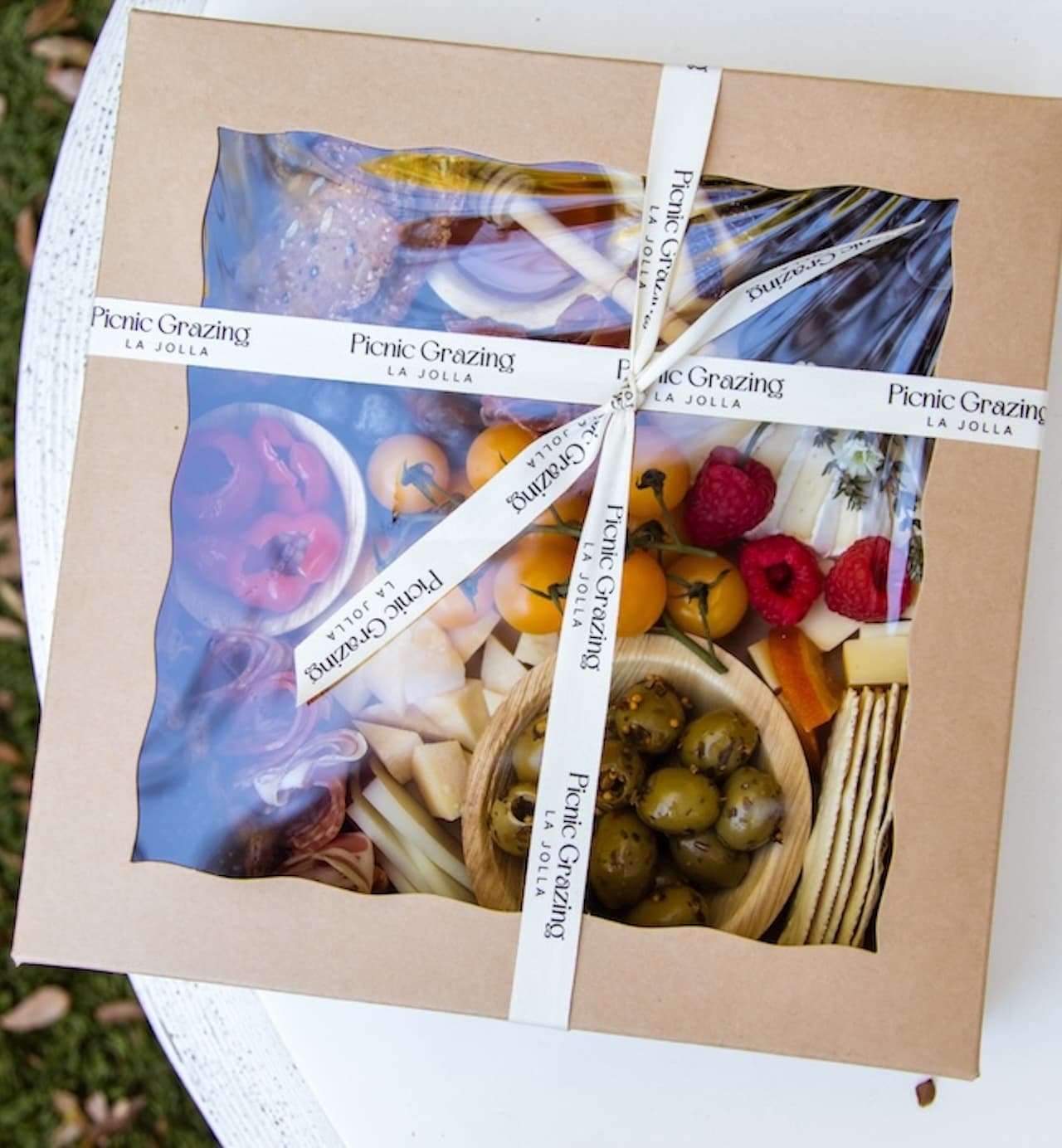 A thoughtfully curated picnic box, perfect for grazing, sharing, and slow afternoons outdoors.
