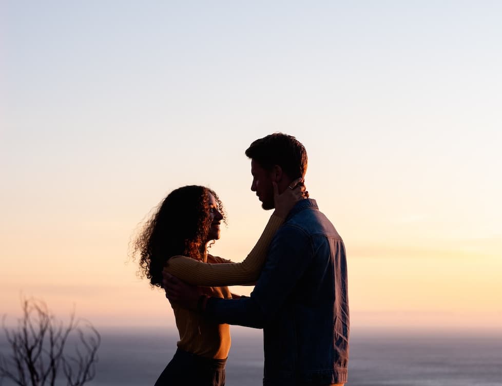 Passionate man and woman with a sunset background