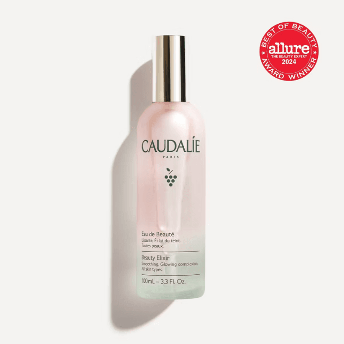 Caudalie Beauty Elixir facial mist bottle on a white background, featuring an Allure Best of Beauty award badge