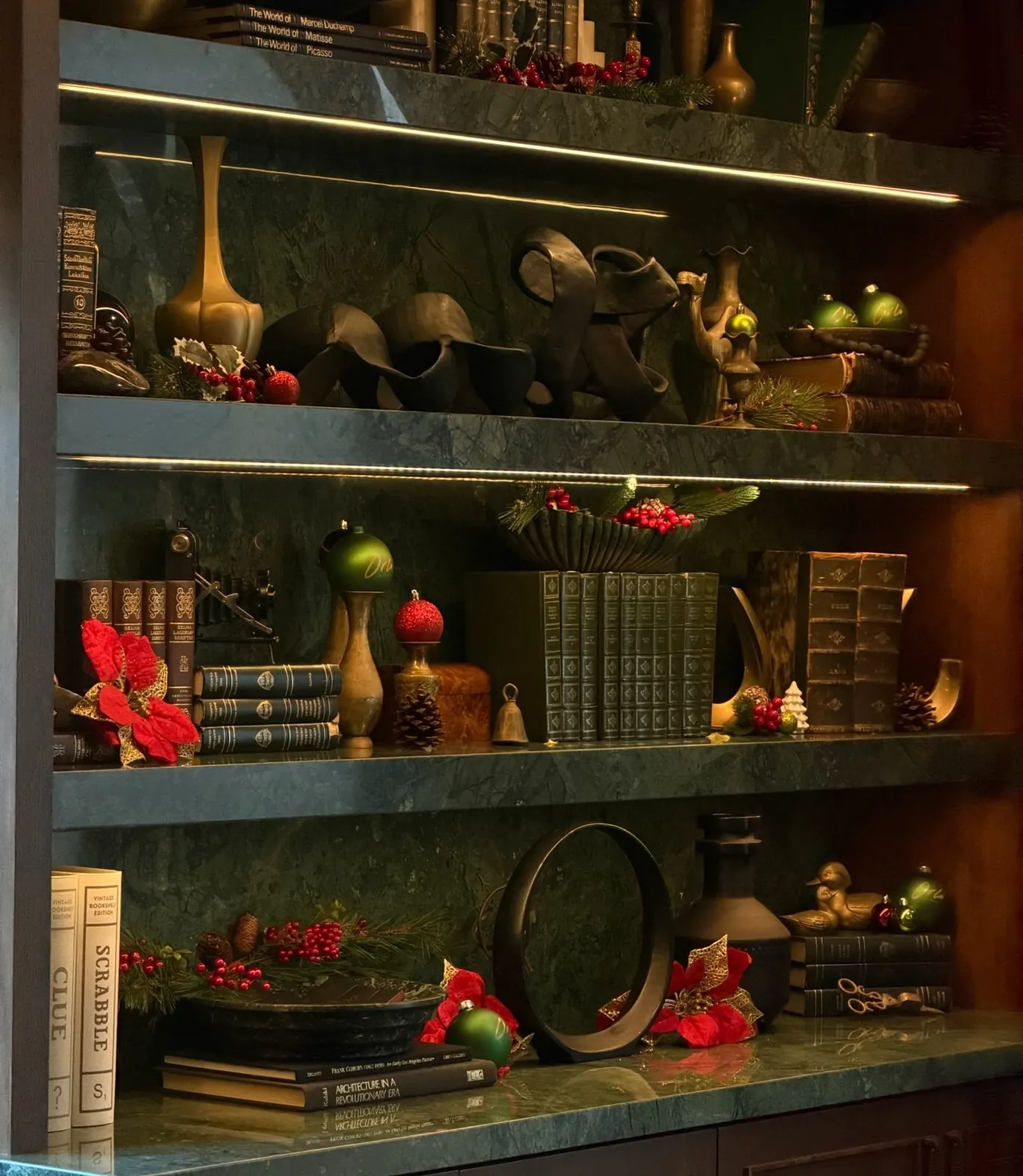 Christmas decorations on the library shelves at Orli La Jolla